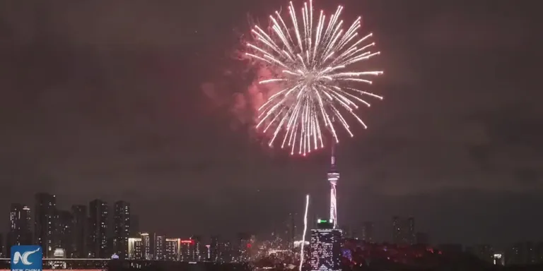 Fireworks light up the Yangtze River in Wuhan for China's National Day