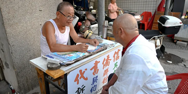 For decades, families relied on letter writers like Jiang Mingdian to stay connected with relatives abroad