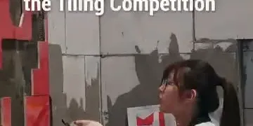 During the ongoing 48th WorldSkills Competition in Shanghai, a young woman carefully laying tiles in the Wall and Floor Tiling s...